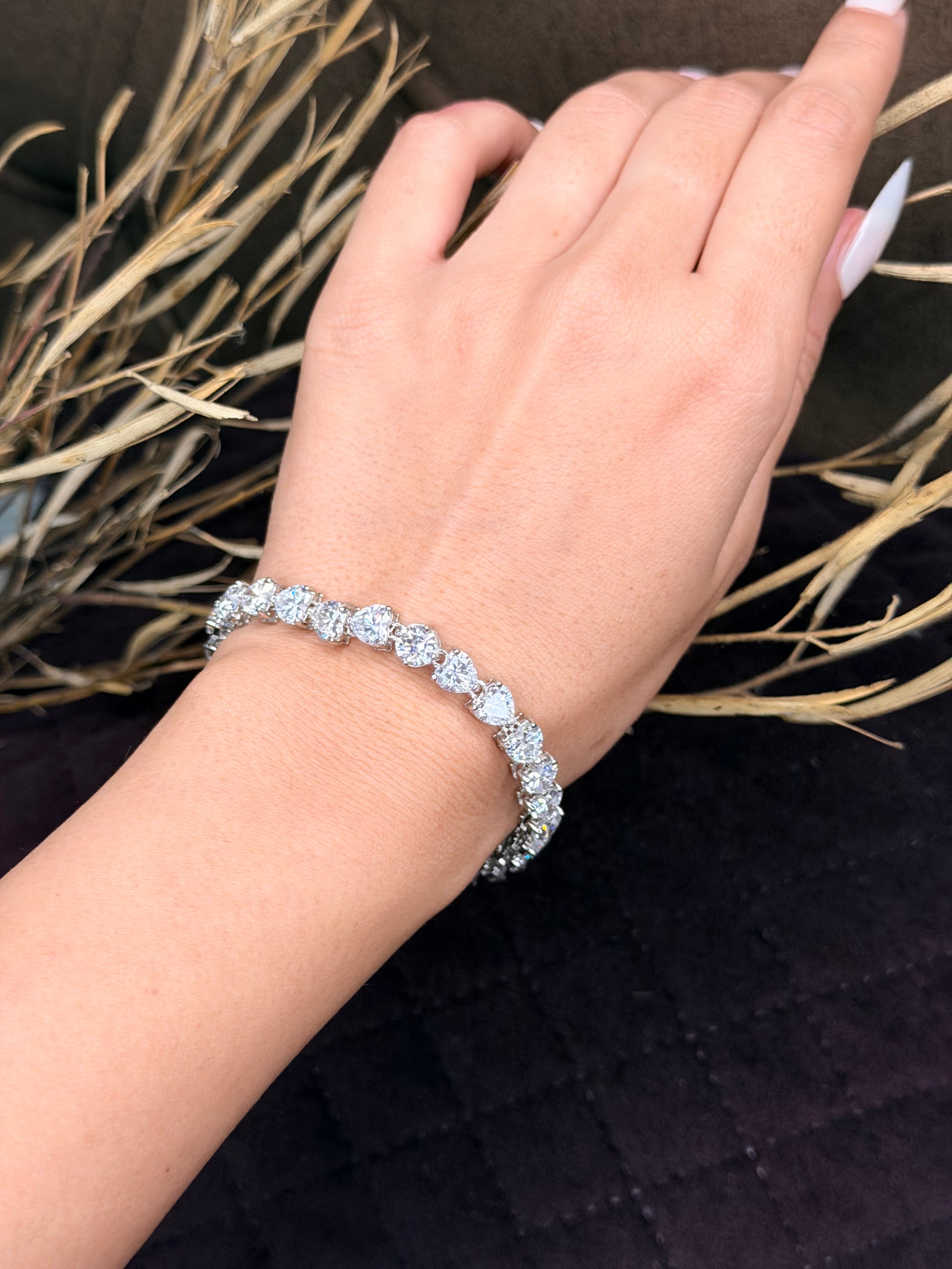 Silver heart shaped diamond tennis bracelet